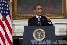 Tổng thống Mỹ Barack Obama phát biểu sau khi các công sở liên bang chính thức được mở cửa lại, tại Washington, DC., ngày 17/10. (Ảnh: AFP/TTXVN)