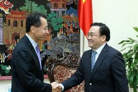 Phó Thủ tướng Hoàng Trung Hải tiếp ông Jin Yong Cai, Phó Chủ tịch kiêm Tổng Giám đốc Công ty Tài chính quốc tế (IFC). (Ảnh: Lâm Khánh/TTXVN)