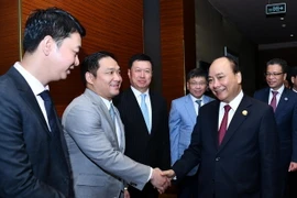 Thủ tướng Nguyễn Xuân Phúc làm việc với Lãnh đạo Tập đoàn Bình An, Tập đoàn Greenland và Công ty Xây dựng Cảng Trung Quốc. (Ảnh: Thống Nhất/TTXVN)