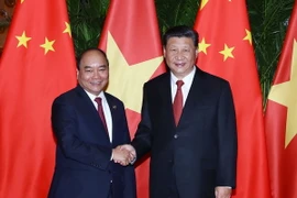 Thủ tướng Nguyễn Xuân Phúc và Tổng Bí thư, Chủ tịch Trung Quốc Tập Cận Bình. (Ảnh: Thống Nhất/TTXVN)