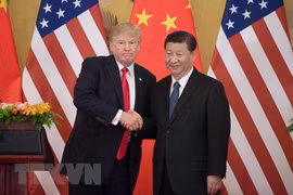 Tổng thống Mỹ Donald Trump (trái) và Chủ tịch Trung Quốc Tập Cận Bình. (Nguồn: AFP/TTXVN)