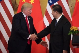 Chủ tịch Trung Quốc Tập Cận Bình (phải) và Tổng thống Mỹ Donald Trump. (Ảnh: AFP/TTXVN)