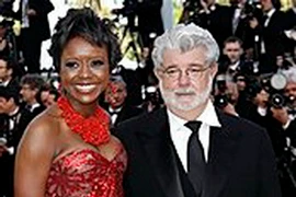 Đạo diễn George Lucas và vị hôn thê Mellody Hobson. (Nguồn: AP)