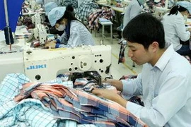 Dệt may là một mặt hàng xuất khẩu thế mạnh của Bình Dương. (Ảnh: TTXVN)