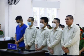 Các bị cáo tại phiên tòa ngày 16/10. (Ảnh: Huyền Trang/TTXVN)