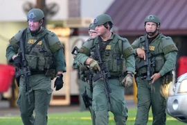 Cảnh sát Mỹ làm nhiệm vụ tại hiện trường một vụ nổ súng. (Nguồn: AFP/TTXVN)