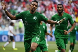 Các cầu thủ đội tuyển Saudi Arabia ăn mừng chiến thắng. (Nguồn: AFP/TTXVN)