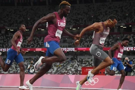 3 vận động viên Mỹ về sau đối thủ người Canada ở nội dung chạy 200m nam. (Nguồn: ustoday)