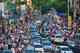 Mỗi người dân chỉ có một biển số xe nhằm giảm ùn tắc giao thông. (Ảnh: PV/Vietnam+)