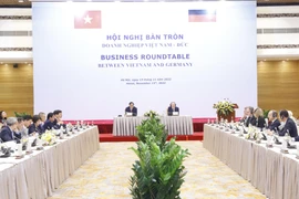 Thủ tướng Chính phủ Phạm Minh Chính và Thủ tướng Đức Olaf Scholz đồng chủ trì Hội nghị với doanh nghiệp Việt Nam-Đức. (Ảnh: Lâm Khánh/TTXVN)