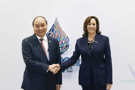 Chủ tịch nước Nguyễn Xuân Phúc gặp Phó Tổng thống Hoa Kỳ Kamala Harris. (Ảnh: Thống Nhất/TTXVN)