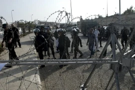 Ai Cập: Phiên xét xử ông Morsi hoãn đến đầu năm 2014