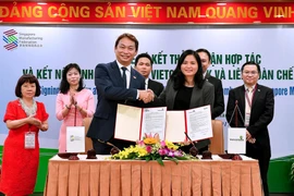 Lãnh đạo hai bên tham gia ký kết. (Nguồn: Vietcombank)