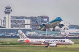 Hành khách sẽ được phục vụ tiêu chuẩn ngang nhau nhờ thương hiệu kép Vietnam Airlines-Jetstar Pacific. (Ảnh: CTV/Vietnam+)