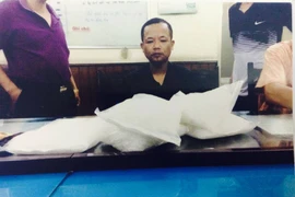 Đối tượng Lê Xuân Sơn tại Cơ quan Cảnh sát điều tra. (Ảnh: PV/Vietnam+)