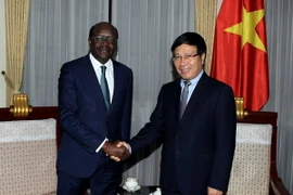 Phó Thủ tướng, Bộ trưởng Bộ Ngoại giao Phạm Bình Minh tiếp ông Mukhisa Kituyi, Tổng thư ký UNCTAD đang thăm và làm việc tại Việt Nam. (Ảnh: Phạm Kiên/TTXVN)