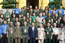 Chủ tịch nước Nguyễn Xuân Phúc với các đại biểu. (Ảnh: Thống Nhất/TTXVN) 