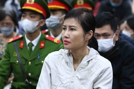 Bị cáo Hoàng Thị Thúy Nga, Phó Tổng Giám đốc AIC tại phiên tòa. (Ảnh: Phạm Kiên/TTXVN)