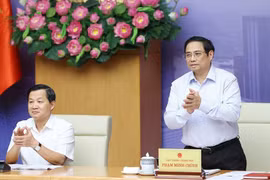 Thủ tướng Phạm Minh Chính và Phó Thủ tướng Lê Minh Khái chủ trì hội nghị phát triển thị trường bất động sản an toàn, lành mạnh, bền vững. (Ảnh: Dương Giang/TTXVN)