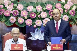 Chủ tịch nước Nguyễn Xuân Phúc phát biểu tại buổi gặp mặt. (Ảnh: Thống Nhất/TTXVN) 