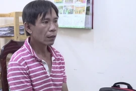 Đối tượng Lê Huy Dũng tại cơ quan công an. (Ảnh: TTXVN phát)
