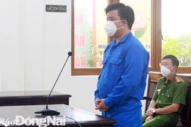 Bị cáo Đặng Quang Toàn tại phiên tòa xét xử. (Nguồn: Báo Đồng Nai)