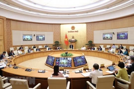  Quang cảnh hội nghị tại điểm cầu Chính phủ. (Ảnh: Dương Giang/TTXVN) 