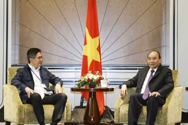 Chủ tịch nước Nguyễn Xuân Phúc tiếp Chủ tịch Phòng Thương mại và Công nghiệp Indonesia Arsjad Rasjid. (Ảnh: Thống Nhất/TTXVN) 