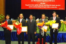 Phần thưởng cho những người có nhiều thành tích trong năm. (Ảnh: Hoàng Chương/Vietnam+)