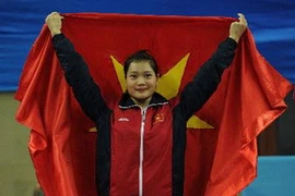 Niềm vui của võ sỹ Lê Bích Phương đoạt huy chương vàng tại ASIAD lần thứ 16. (Nguồn: AFP/TTXVN)