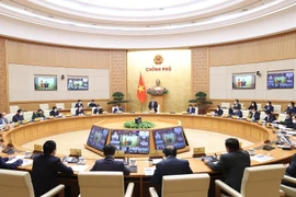 Quang cảnh cuộc họp tại điểm cầu Chính phủ. (Ảnh: Dương Giang/TTXVN)