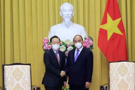 Chủ tịch nước Nguyễn Xuân Phúc tiếp ông Yoon Dae Hee, Chủ tịch Quỹ bảo lãnh tín dụng Hàn Quốc (KODIT). (Ảnh: Thống Nhất/TTXVN)