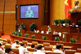 Đại tướng Tô Lâm, Bộ trưởng Bộ Công an trả lời chất vấn. (Ảnh: Doãn Tấn/TTXVN)