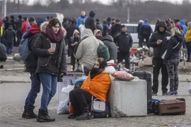 Người tị nạn Ukraine. (Ảnh: AFP/TTXVN)