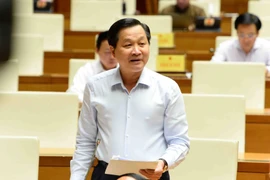 Phó Thủ tướng Lê Minh Khái làm rõ vai trò của Chính phủ trong việc quản lý và điều tiết lĩnh vực ngân hàng, tiền tệ. (Ảnh: Minh Đức/TTXVN)