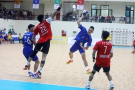 Pha dứt điểm của cầu thủ Nguyễn Quang Đạt (số 7, Việt Nam). (Ảnh: Thế Duyệt/TTXVN)