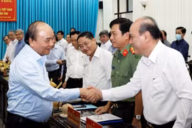 Chủ tịch nước Nguyễn Xuân Phúc với các đại biểu dự buổi làm việc. (Ảnh: Thống Nhất/TTXVN)