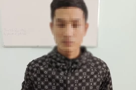 Đối tượng Nguyễn Nu Em tại cơ quan công an. (Ảnh: TTXVN phát)