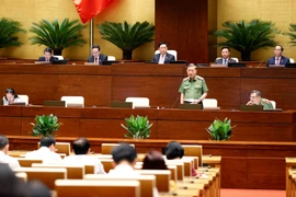 Đại tướng Tô Lâm Bộ trưởng Bộ Công an trả lời chất vấn. (Ảnh: Doãn Tấn/TTXVN)