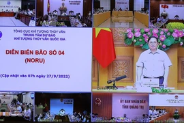 Thủ tướng Phạm Minh Chính chủ trì họp ứng phó cơn bão số 4. (Ảnh: Dương Giang/TTXVN)