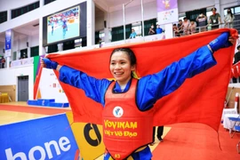 Vận động viên Lê Thị Hiền, đội tuyển Vovinam Việt Nam giành huy chương Vàng nội dung đối kháng hạng cân 60kg nữ. (Ảnh: Tuấn Anh/TTXVN)