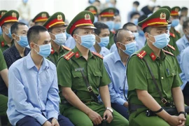 Các bị cáo tại phiên xét xử chiều 8/9. (Ảnh: Doãn Tấn/TTXVN)