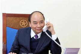 Thủ tướng Nguyễn Xuân Phúc điện đàm với Tổng thống Indonesia. (Ảnh: Thống Nhất/TTXVN)
