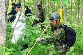 Hơn 200 cảnh sát, tình nguyện viên và nhân viên cứu hộ được huy động để tìm kiếm cậu bé. (Nguồn: Reuters) 