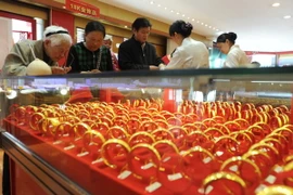 Giá vàng thế giới tăng tuần thứ tư liên tiếp song sẽ chững lại