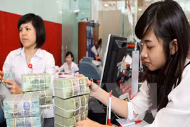 Mức tăng lương tối thiểu năm 2016 thấp hơn năm 2015. (Ảnh minh họa: TTXVN)