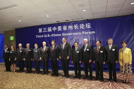 Chủ tịch Trung Quốc Tập Cận Bình (giữa) trong cuộc gặp với giới lãnh đạo doanh nghiệp Mỹ tại Seattle ngày 22/9. (Nguồn: AFP/TTXVN)