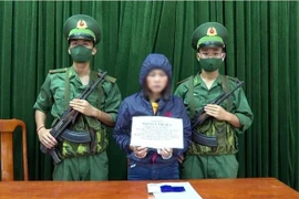 Đối tượng Nguyễn Thị Huế bị bắt giữ. (Ảnh: TTXVN phát)