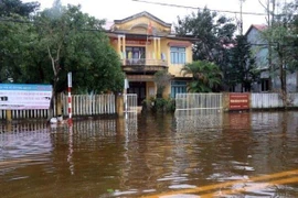 Nhiều xã ở huyện Quảng Điền bị ngập lụt sâu, trên diện rộng. (Ảnh: Đỗ Trưởng/TTXVN)