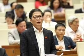 Bộ trưởng Bộ Công Thương Trần Tuấn Anh phát biểu giải trình, làm rõ một số vấn đề đại biểu Quốc hội nêu. (Ảnh: Văn Điệp/TTXVN)